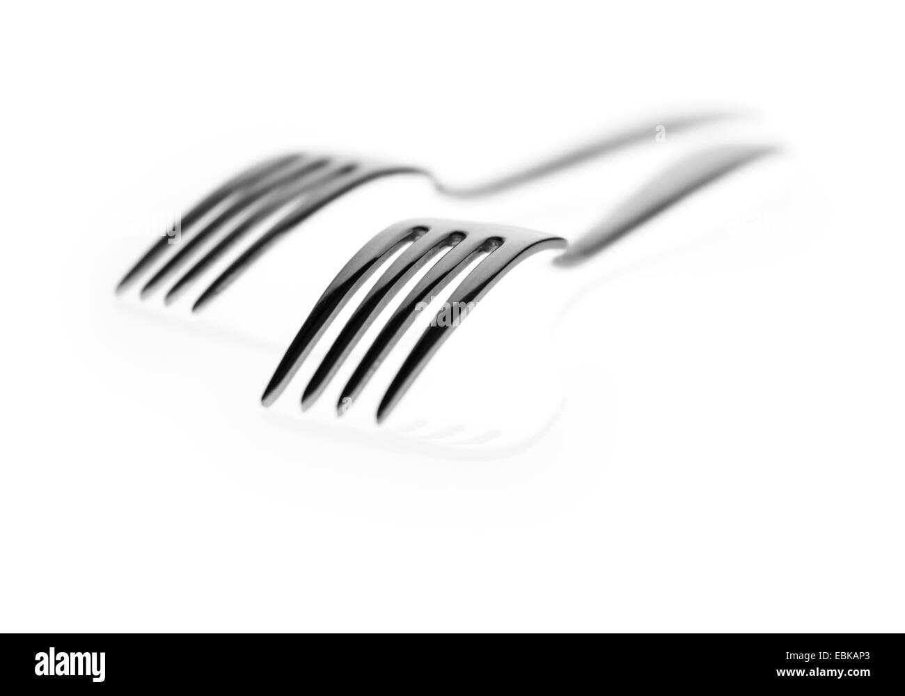 Two forks shot on a light box Stock Photo
