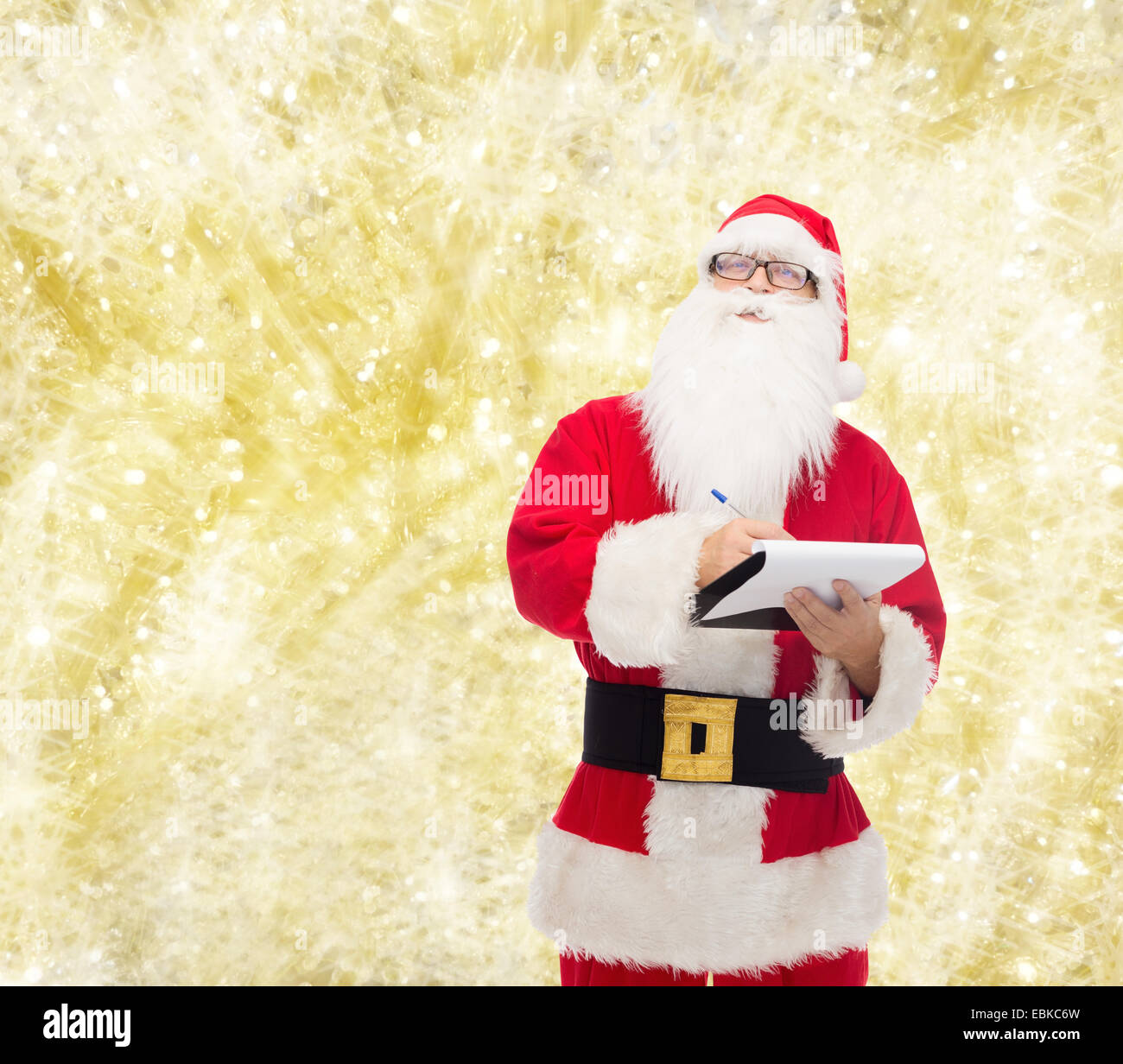 man in costume of santa claus with notepad Stock Photo - Alamy