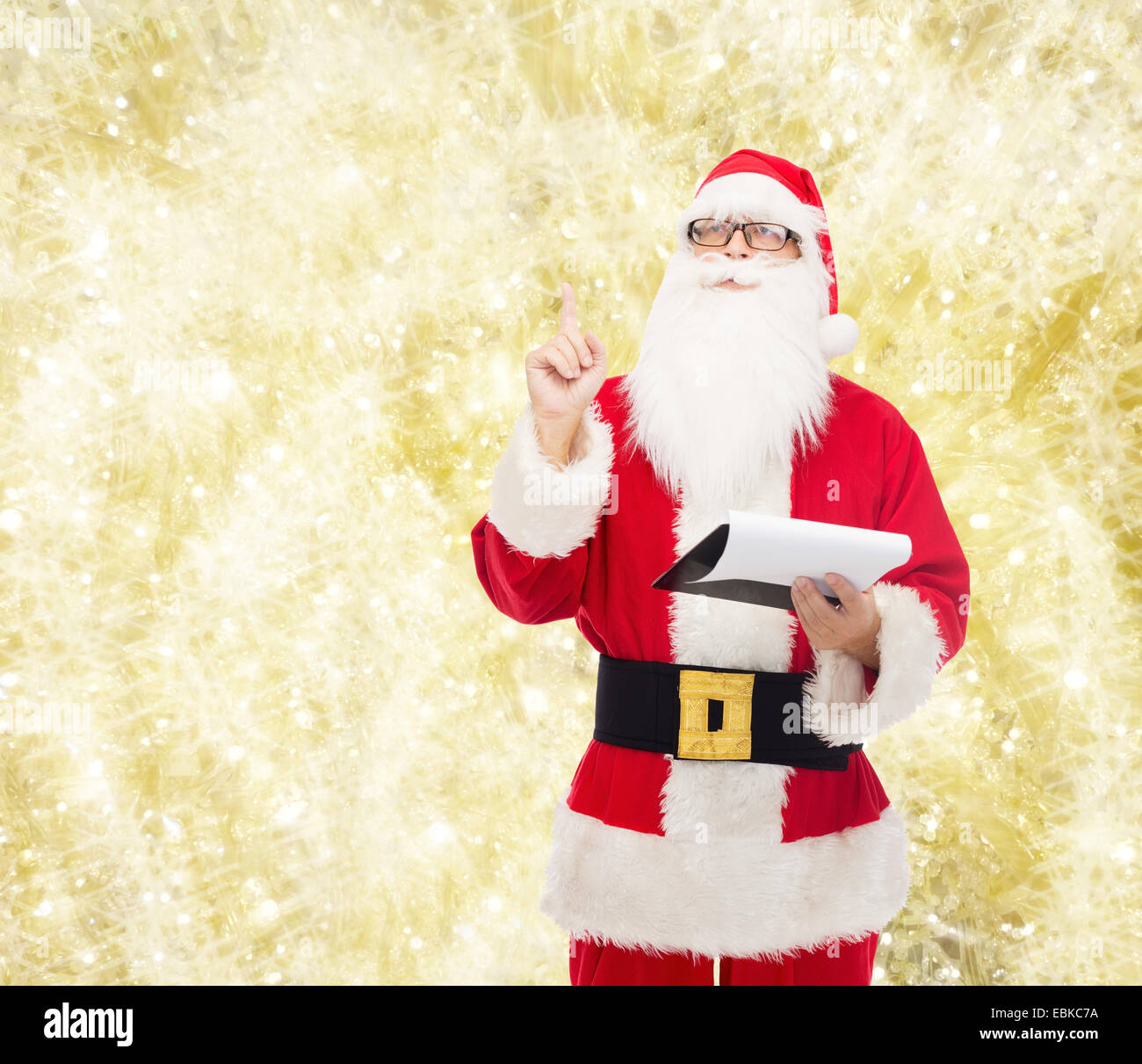 man in costume of santa claus with notepad Stock Photo - Alamy
