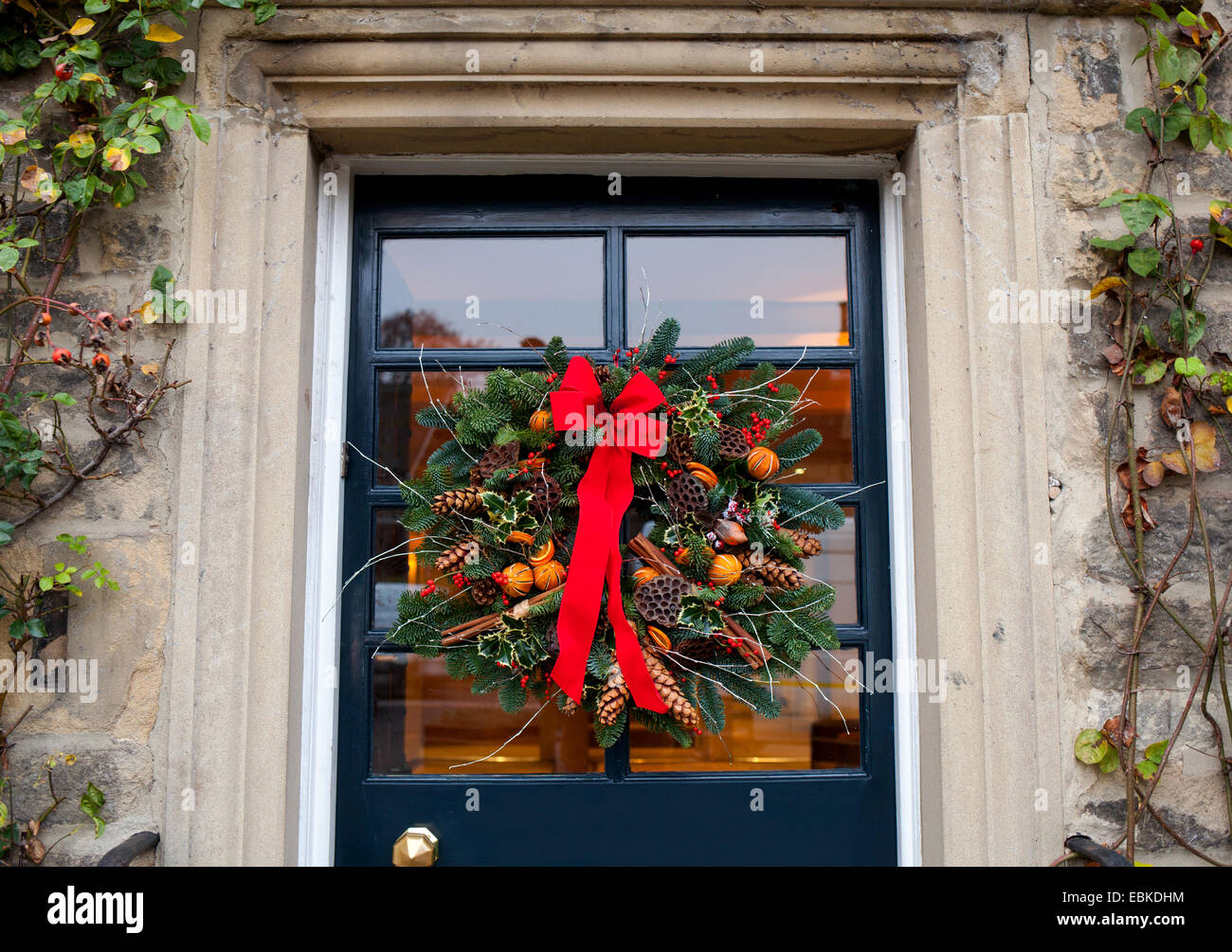 A traditional Christmas wreath on a door in the U.K. Stock Photo