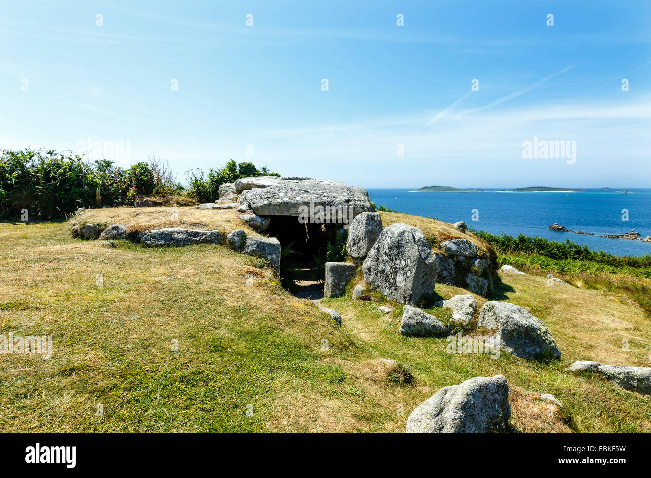 Scilly Isles; Bant’s Carn, a Bronze Age tomb of the type known as an entrance grave, sits on the crest of a hill. Stock Photo