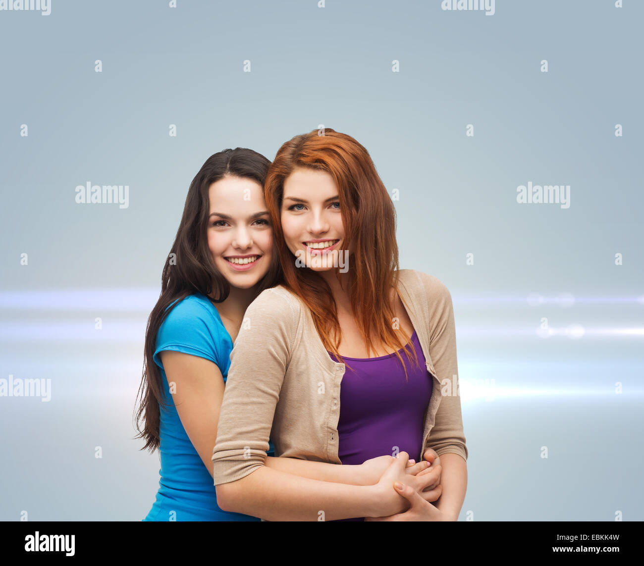 smiling teenage girls hugging Stock Photo - Alamy