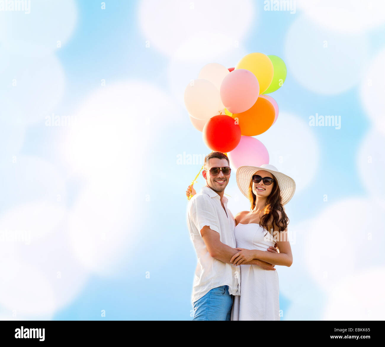 smiling couple with air balloons outdoors Stock Photo - Alamy