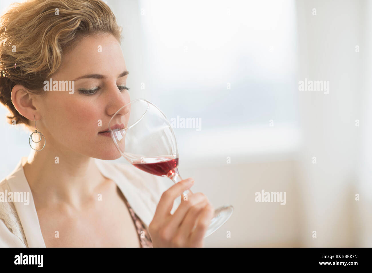 Young woman drinking red wine Stock Photo Alamy