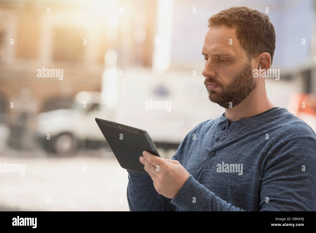 Delivery man using digital tablet Stock Photo