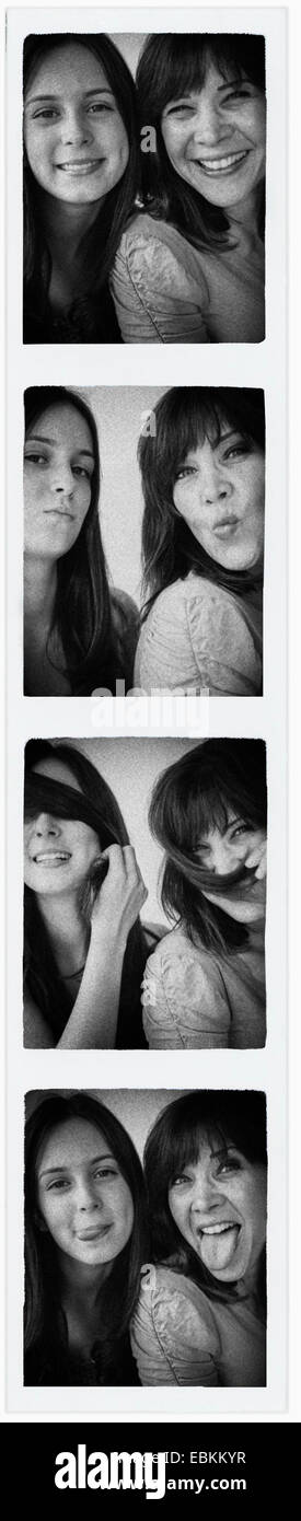 Photo booth picture of teenage girl (14-15) and her mom Stock Photo