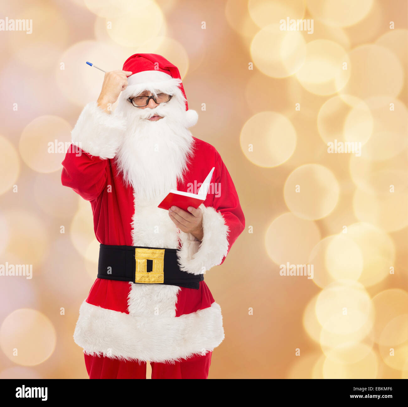 man in costume of santa claus with notepad Stock Photo - Alamy