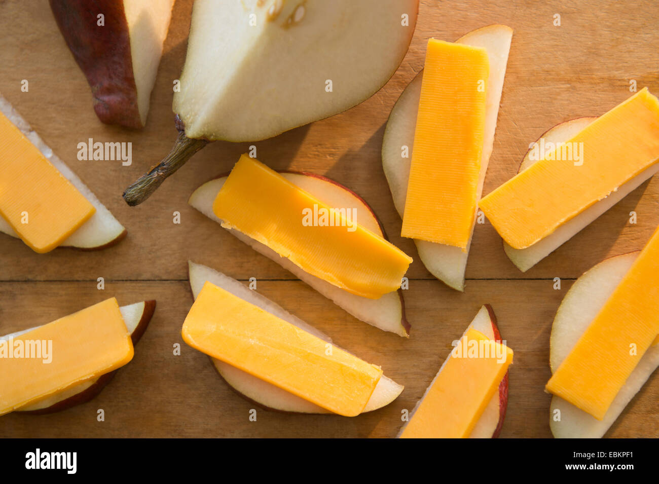 Studio shot of pear slices with cheddar cheese Stock Photo