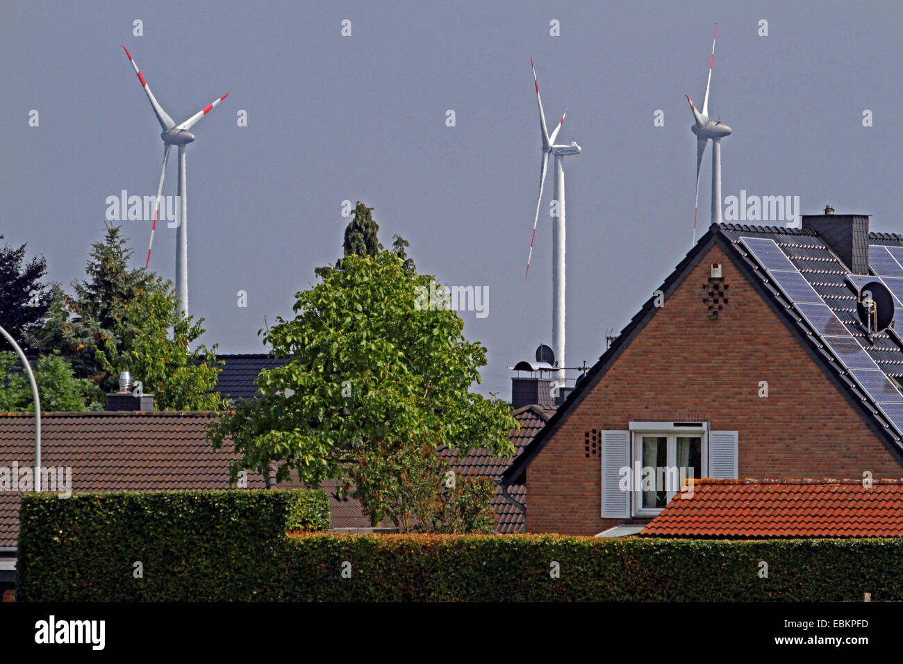 wind power stations near a housing estate, Germany Stock Photo