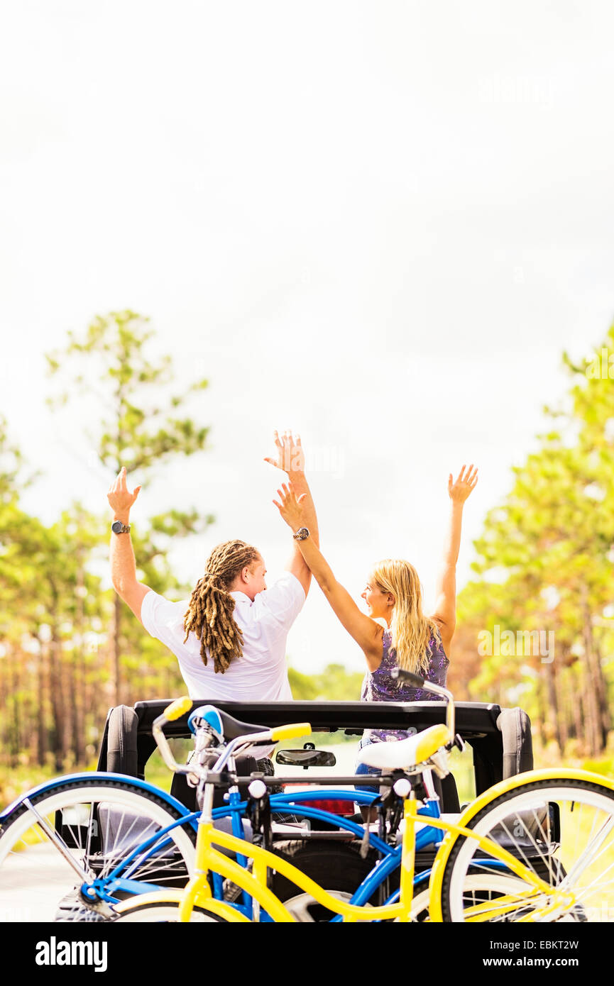 USA, Florida, Tequesta, Couple rising hands in car Stock Photo Alamy