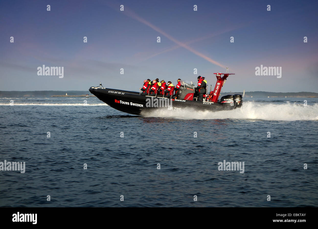 A light-weight high performance  rigid-hulled inflatable boat, (RHIB) or rigid-inflatable boat (RIB) in optimal speed 50kn (50 n Stock Photo