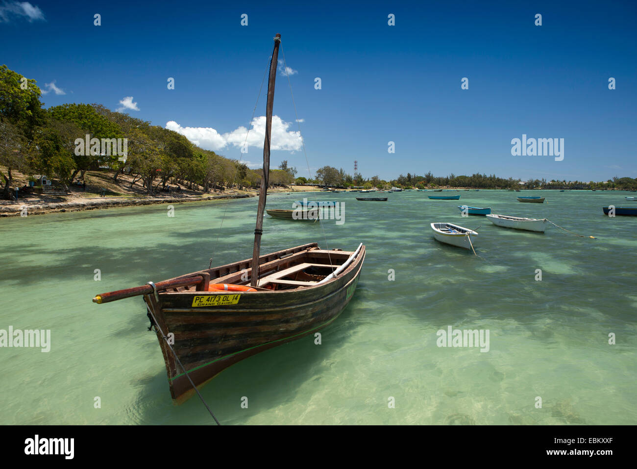 Mauritius, Grand Gaube public beach, fishing boats moored in aquamarine sea Stock Photo