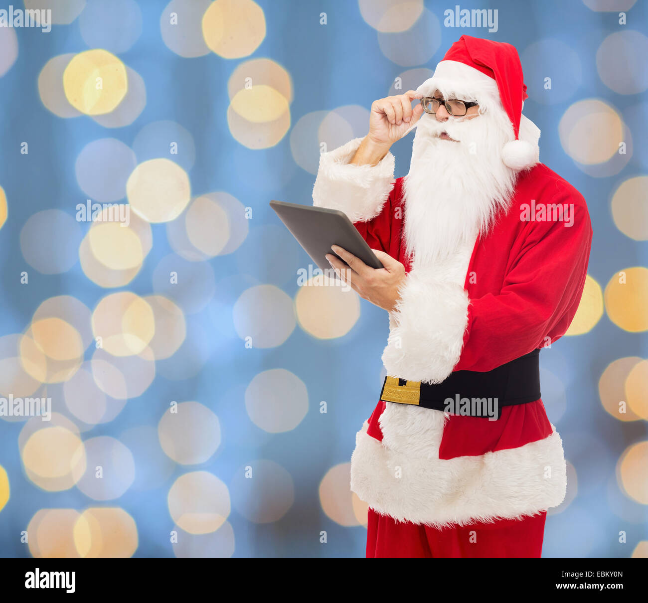 man in costume of santa claus with tablet pc Stock Photo - Alamy