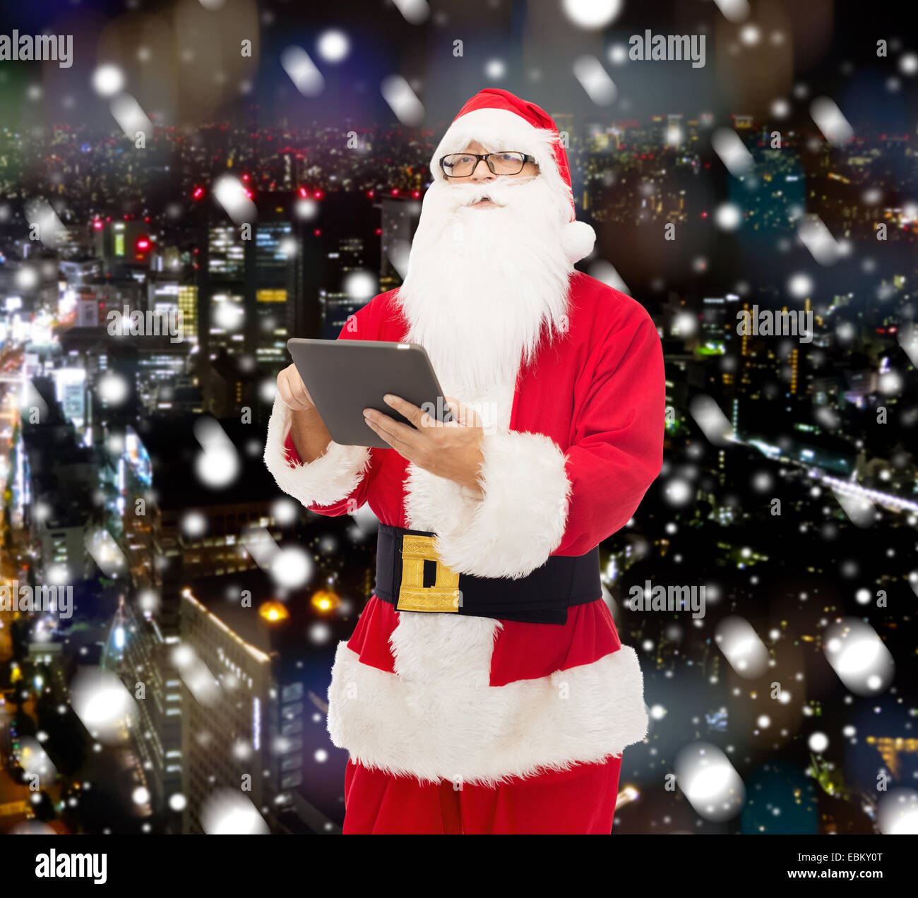 man in costume of santa claus with tablet pc Stock Photo - Alamy
