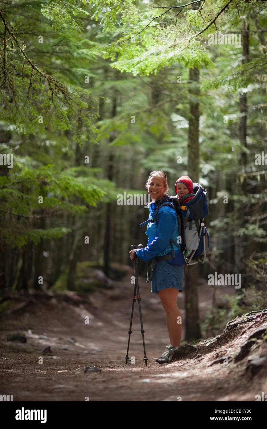 USA, Montana, Glacier National Park, Woman with son (4-5) on trail of cedars Stock Photo