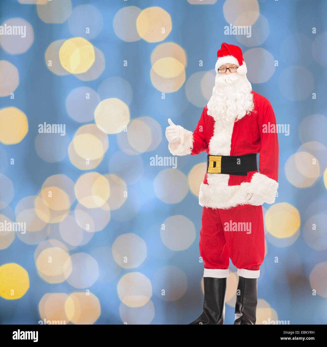man in costume of santa claus showing thumbs up Stock Photo - Alamy