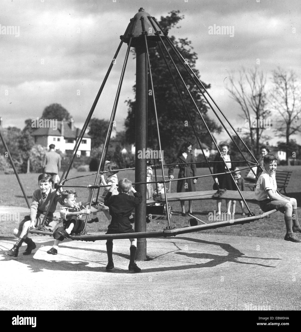CHILDREN ON ROUNDABOUT about 1945 Stock Photo
