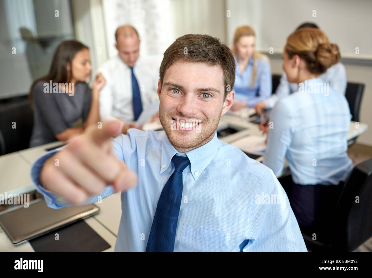 group of smiling businesspeople meeting in office Stock Photo - Alamy