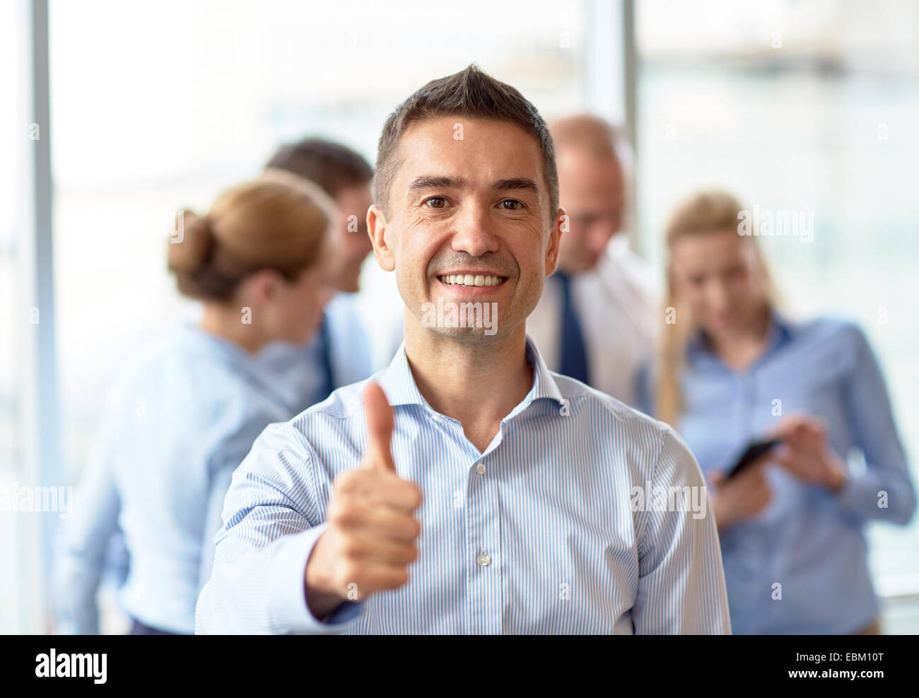 group of smiling businesspeople meeting in office Stock Photo - Alamy