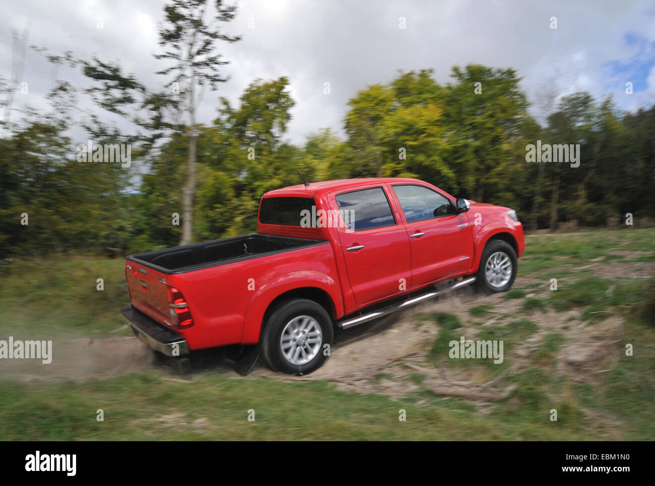 2012 Toyota Hilux Invincible 4 wheel drive pick up truck driving off road Stock Photo