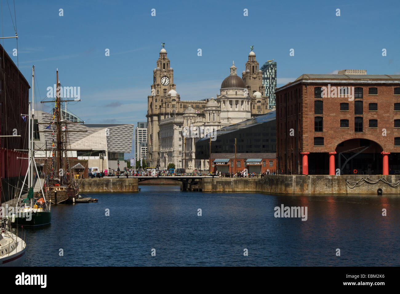 Liver Building from the Albert Dock, Liverpool showing sailing vessels and dock buildings Stock Photo