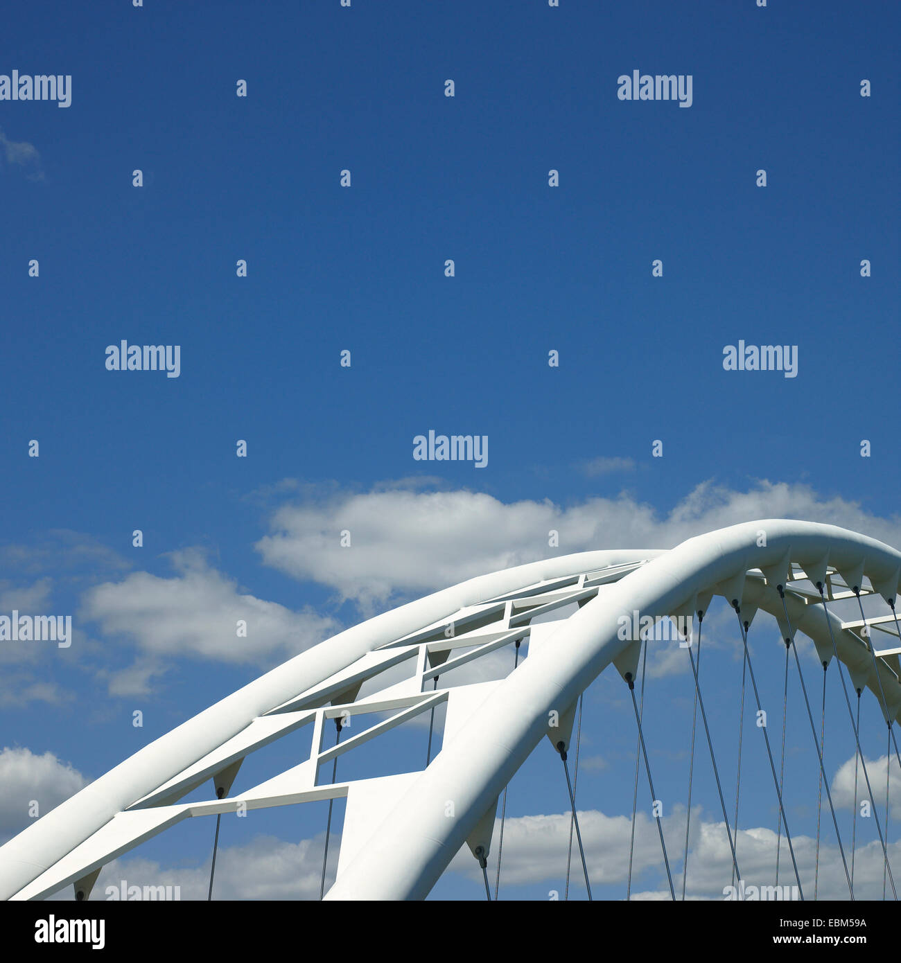 White steel curved modern bridge Stock Photo - Alamy