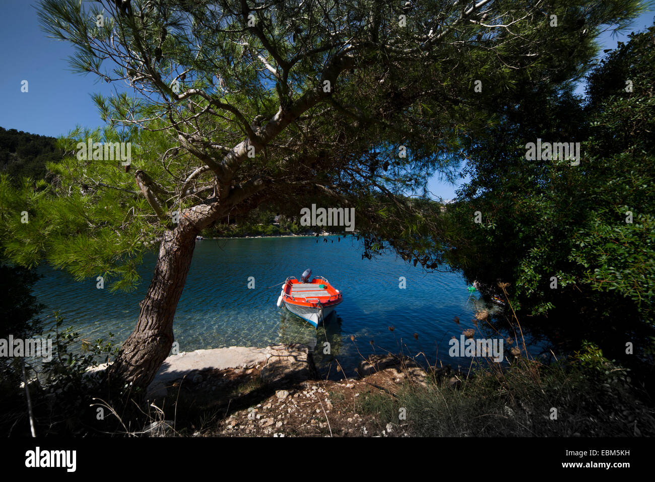 Paxos, Mongonissi, water, boat, tree, blue, sky Stock Photo