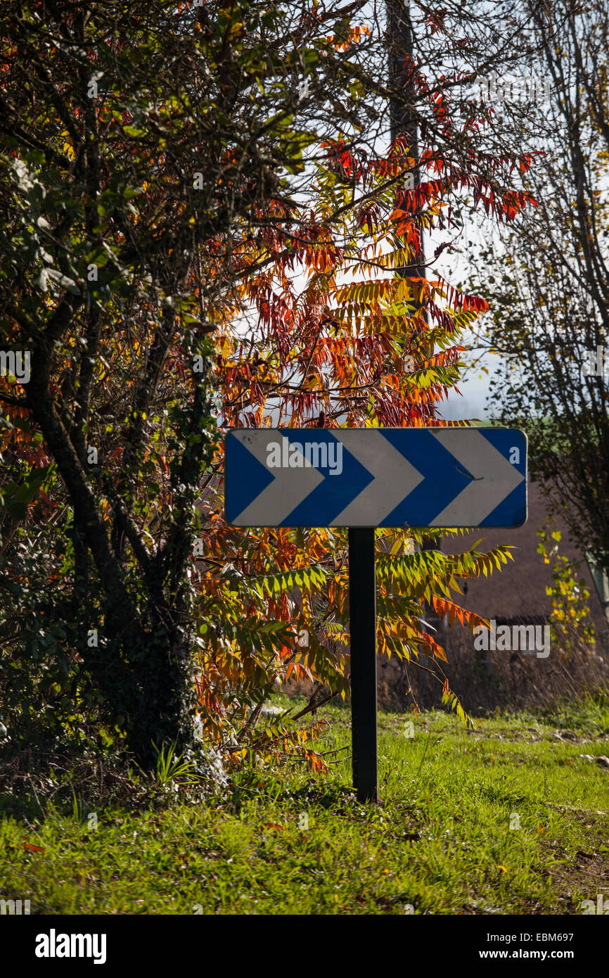 Bend road sign in autumnal Brittany Stock Photo