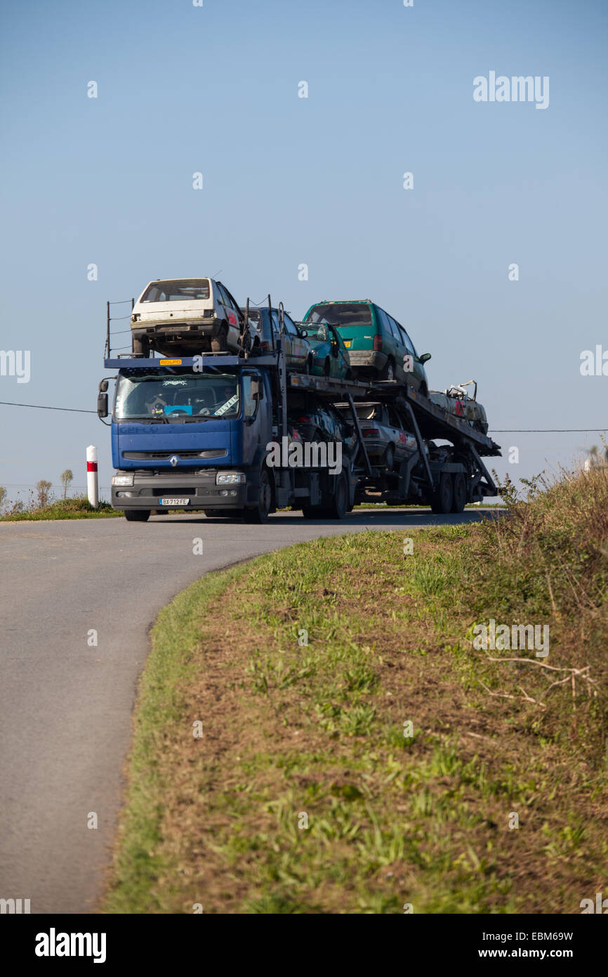 Car transporter carrying written off vehicles Stock Photo