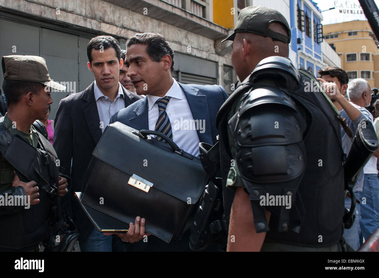 Caracas, Venezuela. 2nd Dec, 2014. Juan Carlos Gutierrez (C), attorney of the opposition leader Leopoldo Lopez, arrives at the Palace of Justice in Caracas, Venezuela, on Dec. 2, 2014. The UN High Commissioner for Human Rights Zeid Ra'ad Al Hussein called on late October for the 'immediate release' of Venezuelan right-wing politicians Leopoldo Lopez and Daniel Ceballos, and others arrested following violent anti-government protests that left 40 dead. Credit:  Boris Vergara/Xinhua/Alamy Live News Stock Photo
