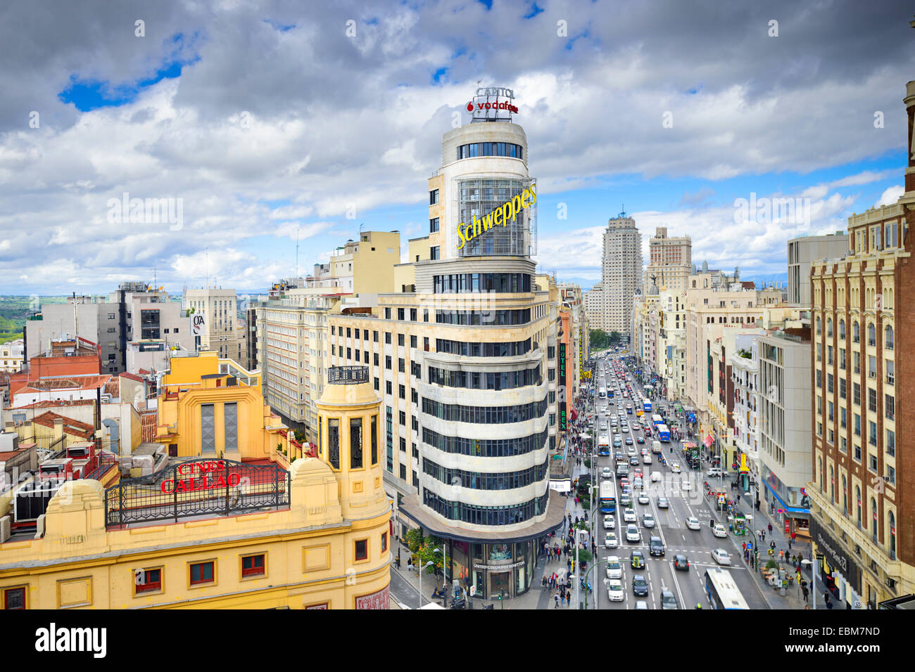 MADRID, SPAIN - OCTOBER 15, 2014: Gran Via at the Iconic Schweppes Building. The street is the main shopping district of Madrid. Stock Photo