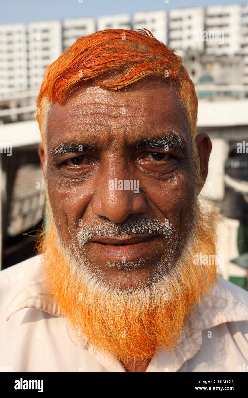 a-man-with-henna-is-his-hair-and-beard-at-sadarghat-boat-terminal-EBM9G1.jpg