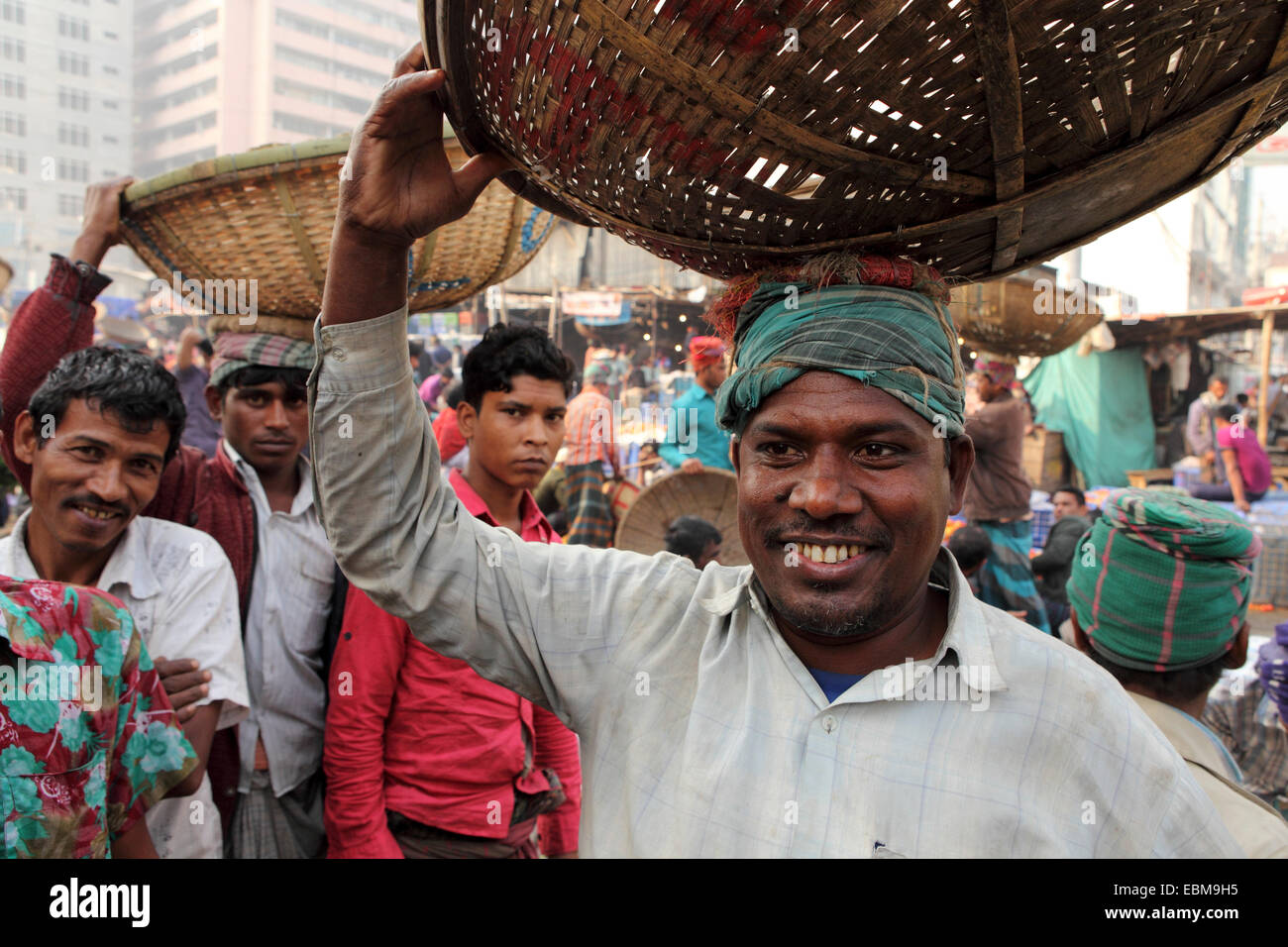 A porter at Gulshan Market in Dhaka, Bangladesh. Fruit and vegetables are sold wholesale at the market. Stock Photo