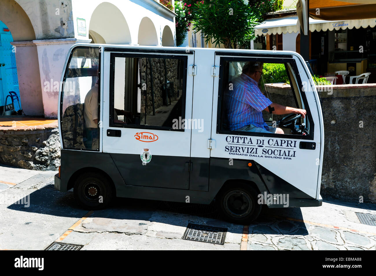 Municipal transport using tiny vehicles to negotiate some of the narrow lanes and alleys on the island of Capri. Stock Photo