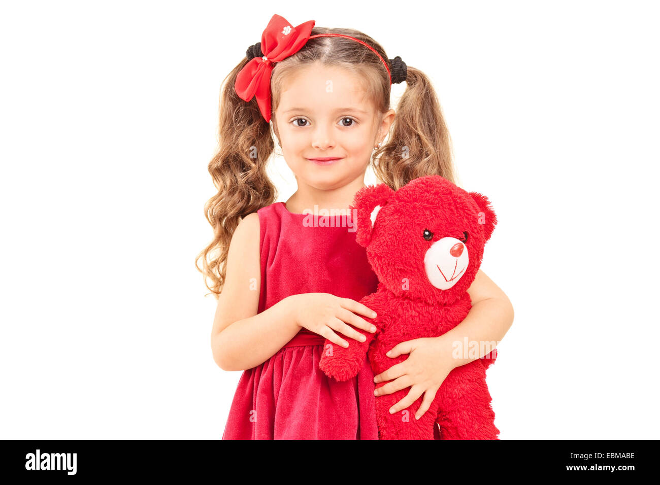 little girl holding teddy bear