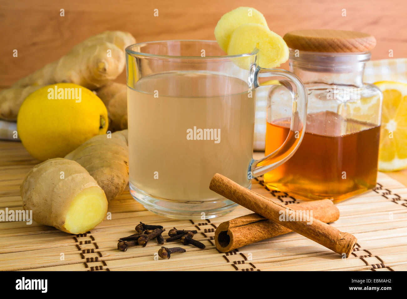 ginger tea with all the ingredients like ginger itself, lemon, honey and cinamon Stock Photo