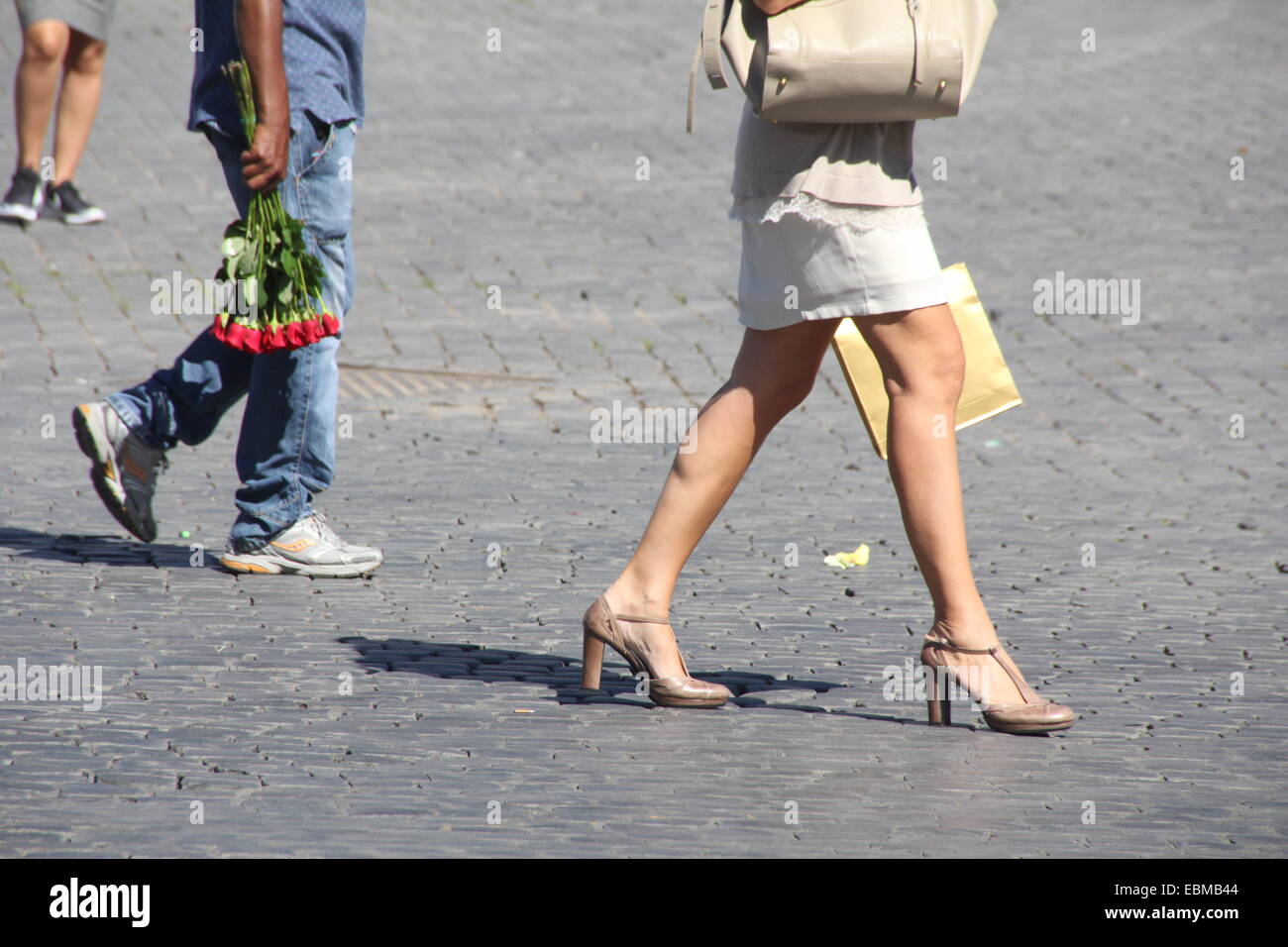 woman walking in street in rome italy Stock Photo