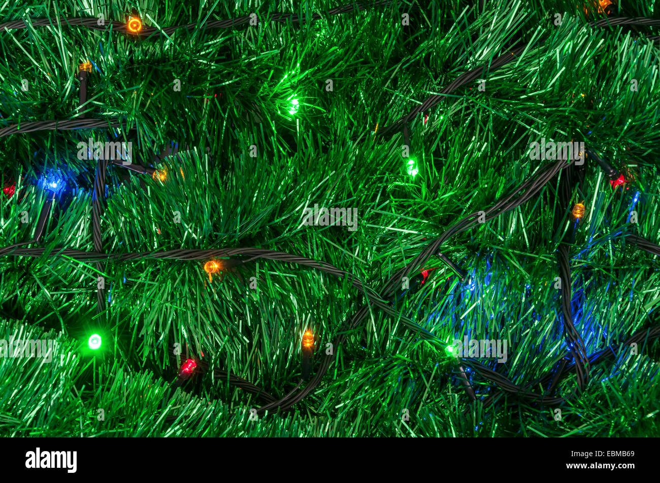 Closeup of christmas garland background with colored lights Stock Photo