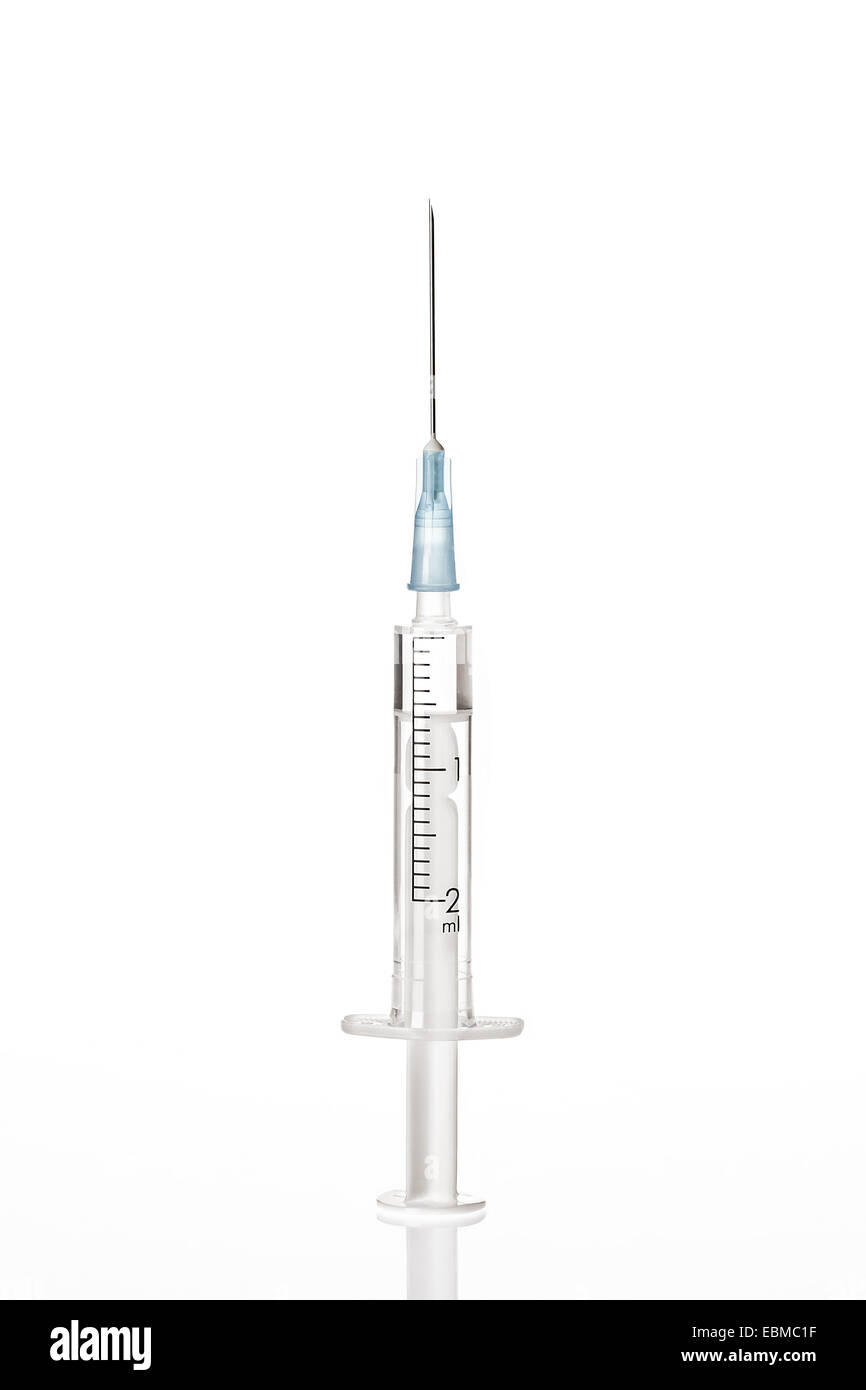 Close up view of white plastic syringe on white back Stock Photo - Alamy