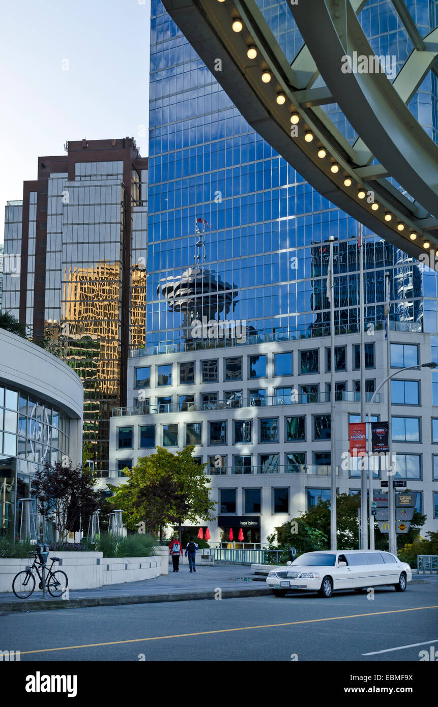 Reflection of the Harbour Centre tower and other buildings in the glass of Waterfront Centre building in downtown Vancouver, BC, Stock Photo