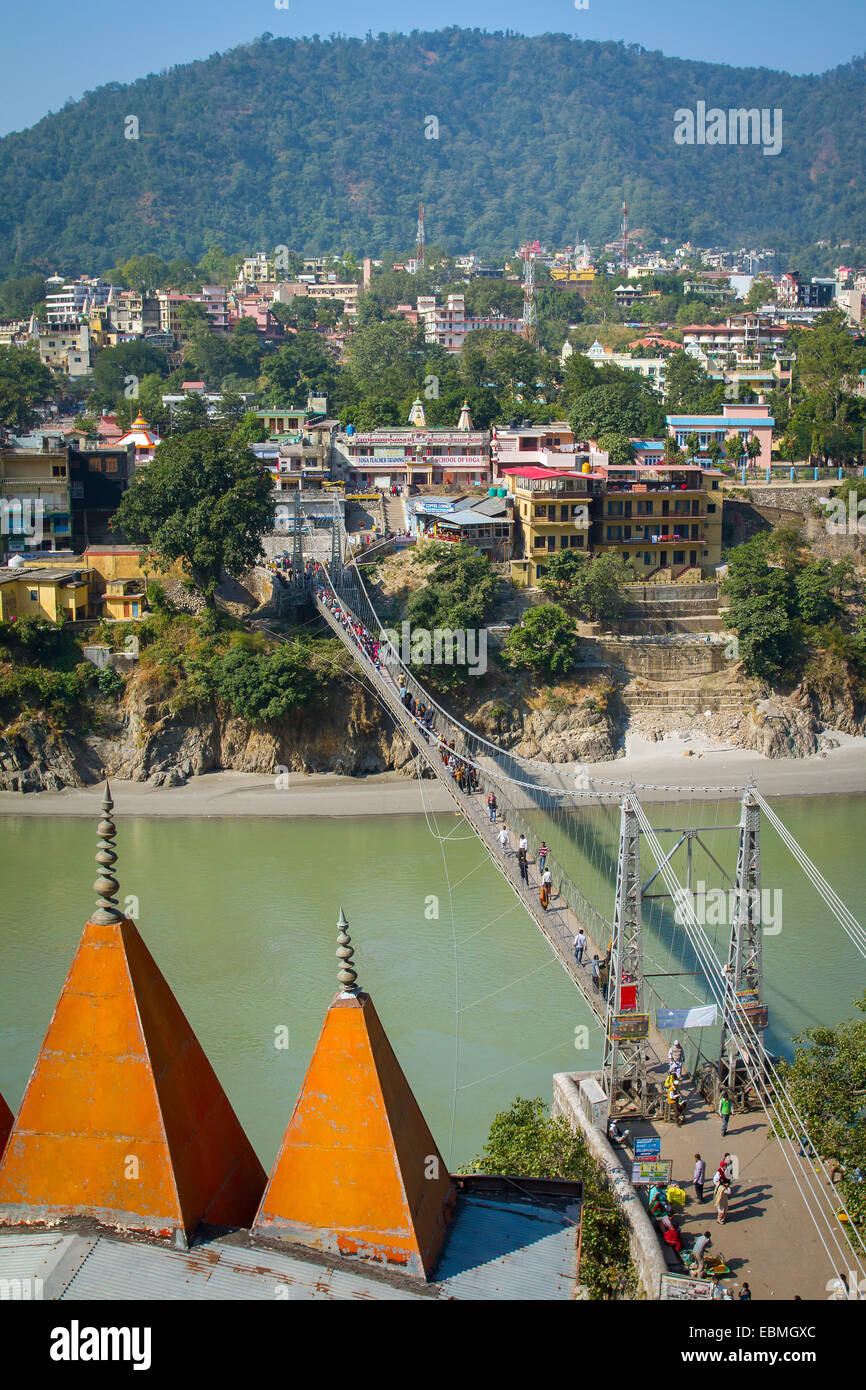 Laxman Jhula bridge over Ganges river in Rishikesh, India Stock Photo