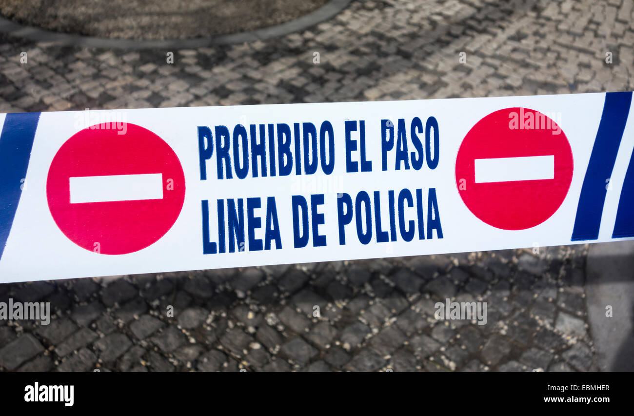 Police tape in Spanish Stock Photo