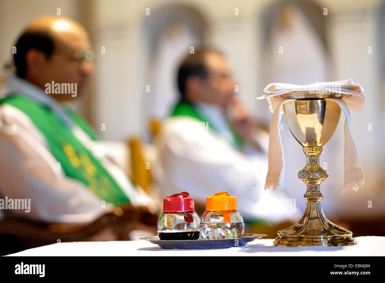 Catholic mass, chalice and containers with wine and water for the