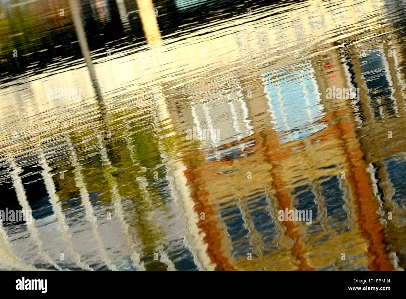Nottingham city centre buildings reflected in the fountain water feature.England UK Stock Photo