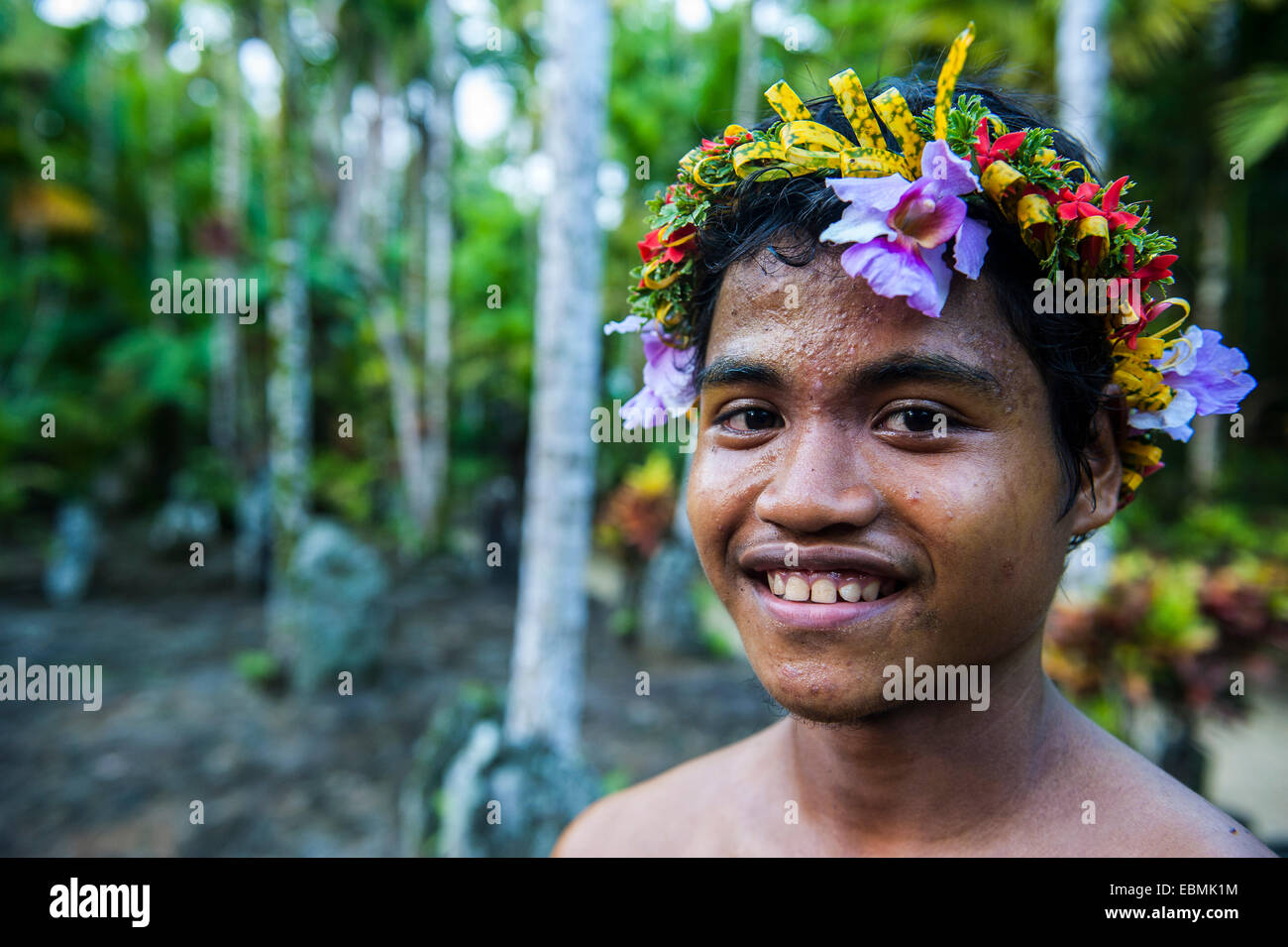 Young man with headdress made of flowers, Yap Island, Caroline Islands, Micronesia Stock Photo
