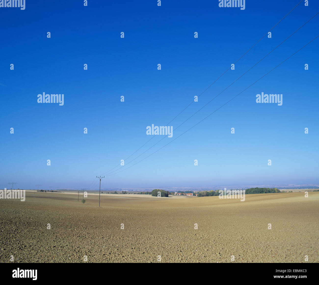 Arable desert, harvested field and power lines, Zimmern, Thuringia, Germany Stock Photo