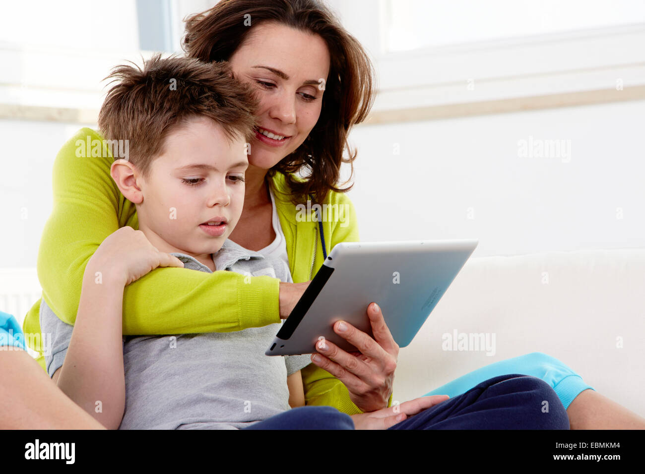 Mother and son using a tablet pc, Germany Stock Photo