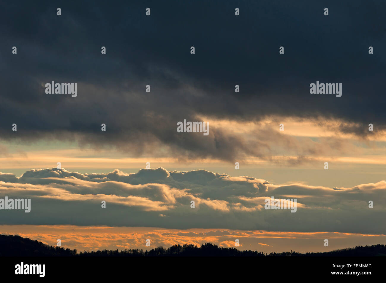 Rain clouds (nimbostratus), below dense clouds with sunset Stock Photo