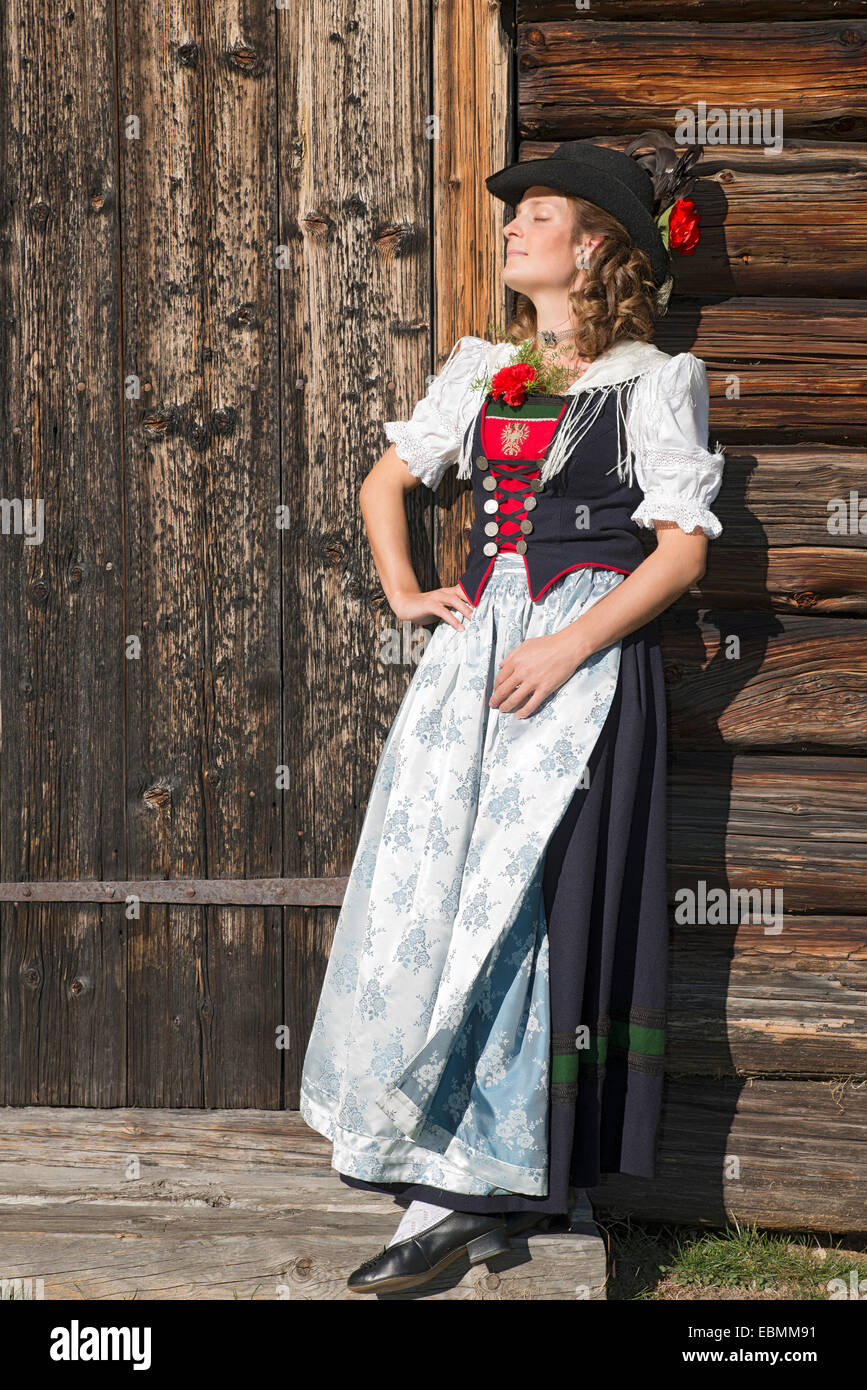 Young woman in traditional costume, Tyrolean traditional costume typical for the region Achensee, Pertisau am Achensee, Tyrol Stock Photo