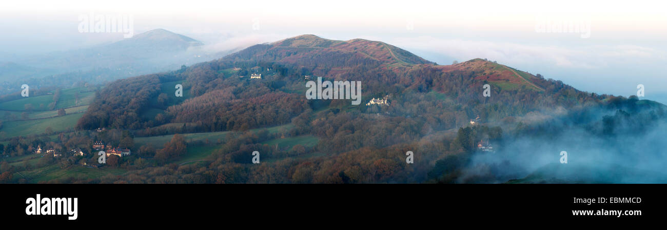 Low cloud and fog is covering the Malverns. The fog briefly parts to show the side of the Malvern Hills. Stock Photo